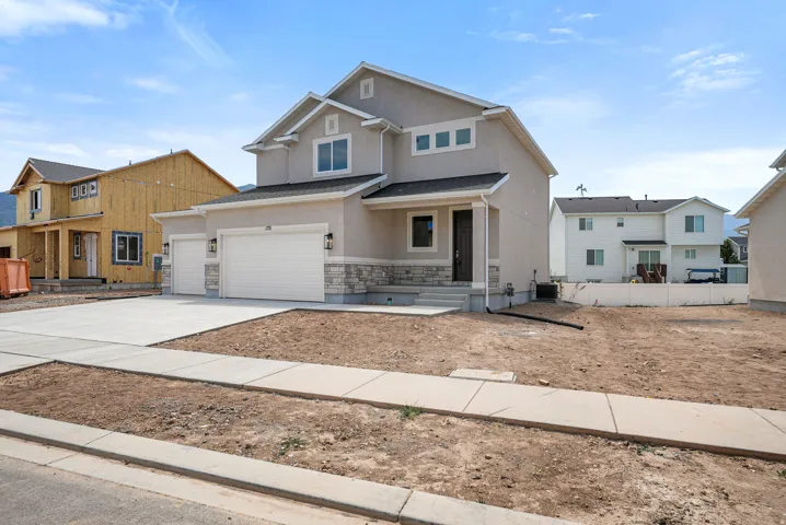 Contemporary two-story stucco exterior with stone accents