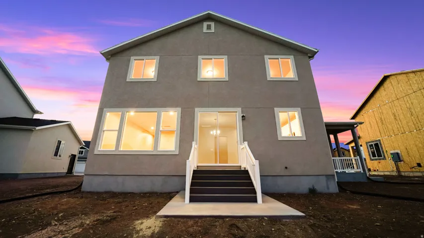 Two-story stucco exterior with white trim