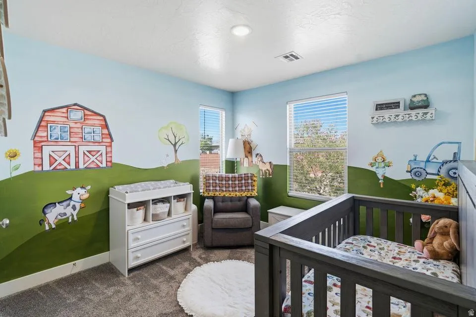 Room featuring carpet flooring and wall murals with a farm theme