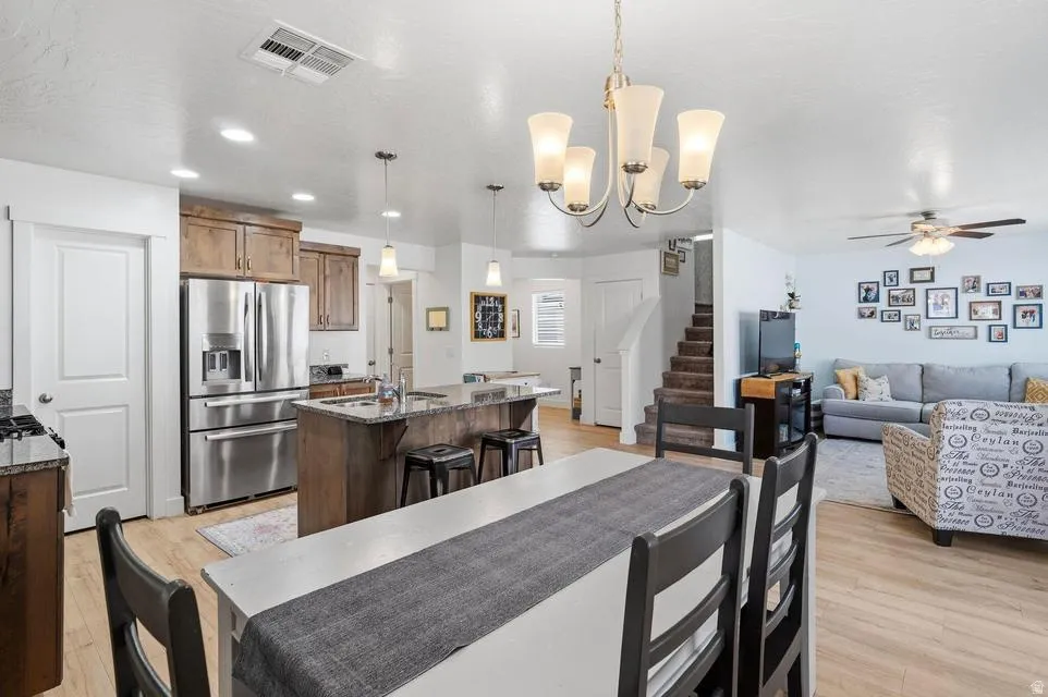 Open-concept living area with wood-finish flooring
