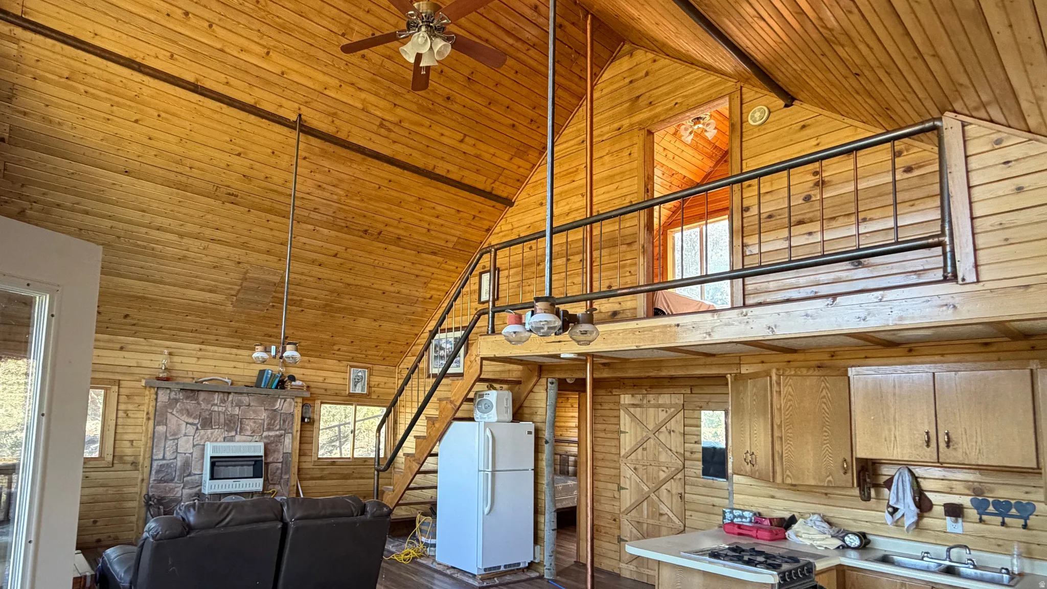 Vaulted wood-finish ceiling with exposed beams