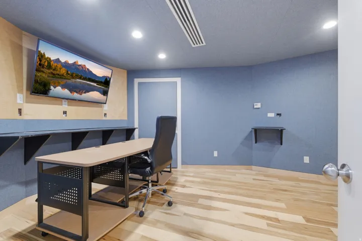 Room featuring light wood-finish flooring, recessed lighting, and a wall-mounted television