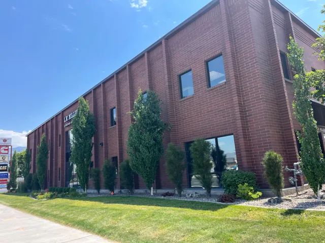 Commercial building featuring a brick facade with vertical architectural accents