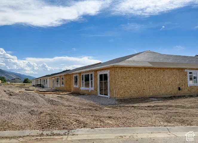 Single-story structure under construction featuring OSB sheathing