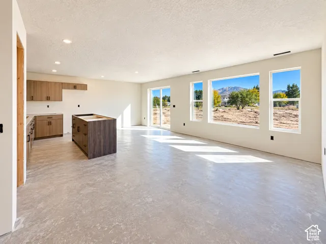 Under construction-huge windows, two-tone cabinetry and sliding door to backyard