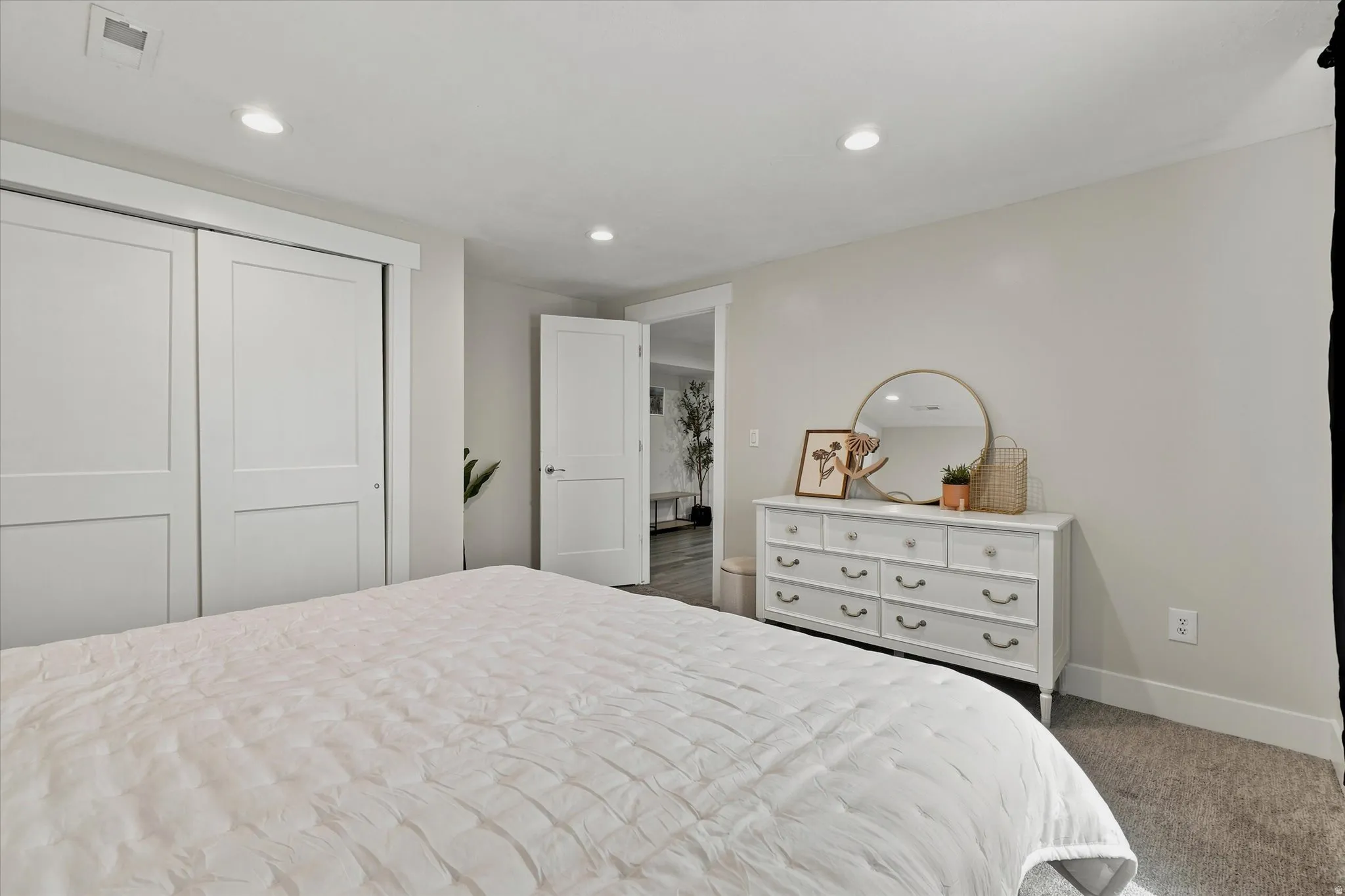Bedroom featuring light gray walls, recessed lighting, and gray carpet flooring