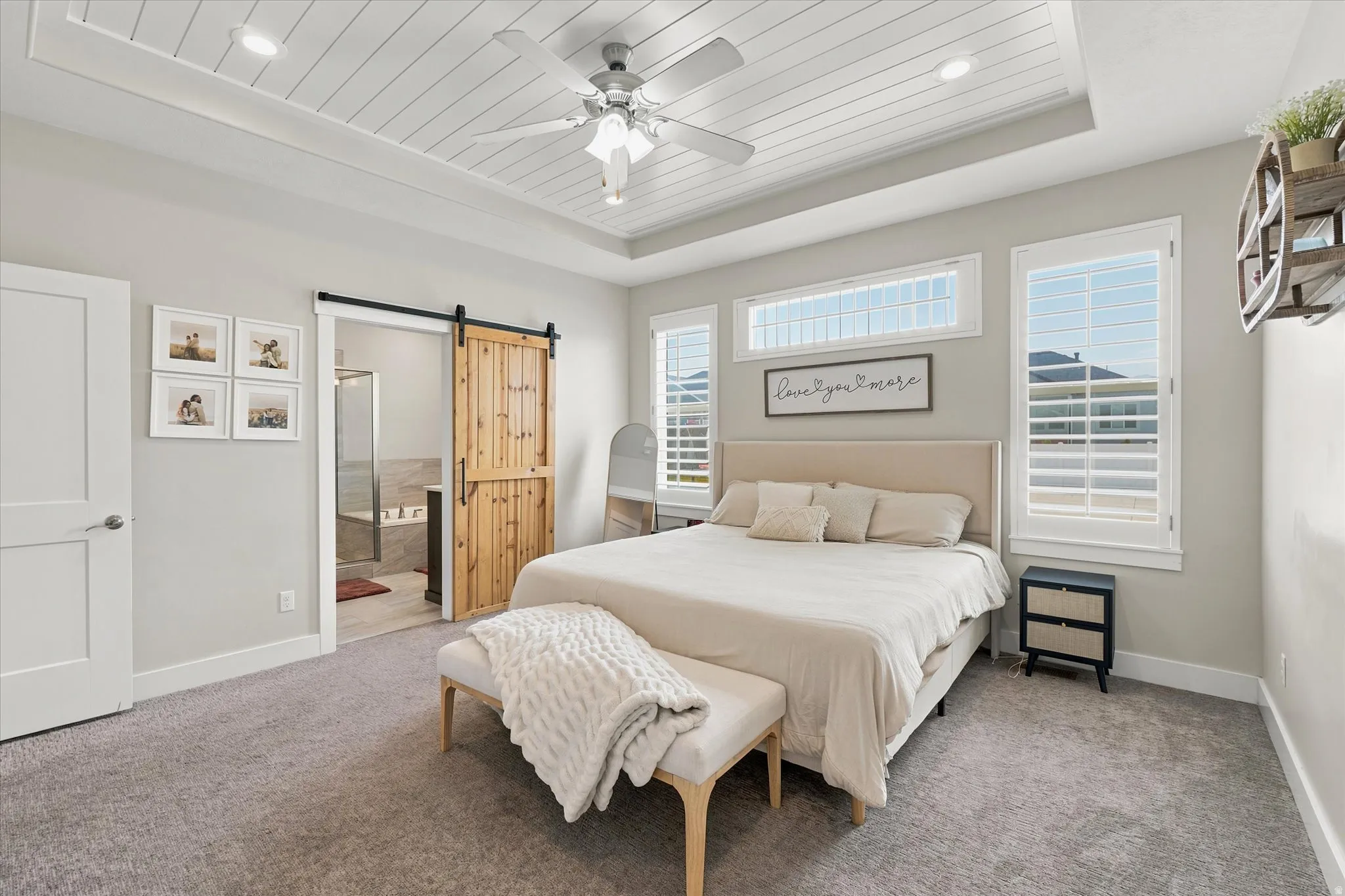 Recessed tray ceiling with plank-style detail, complete with a ceiling fan