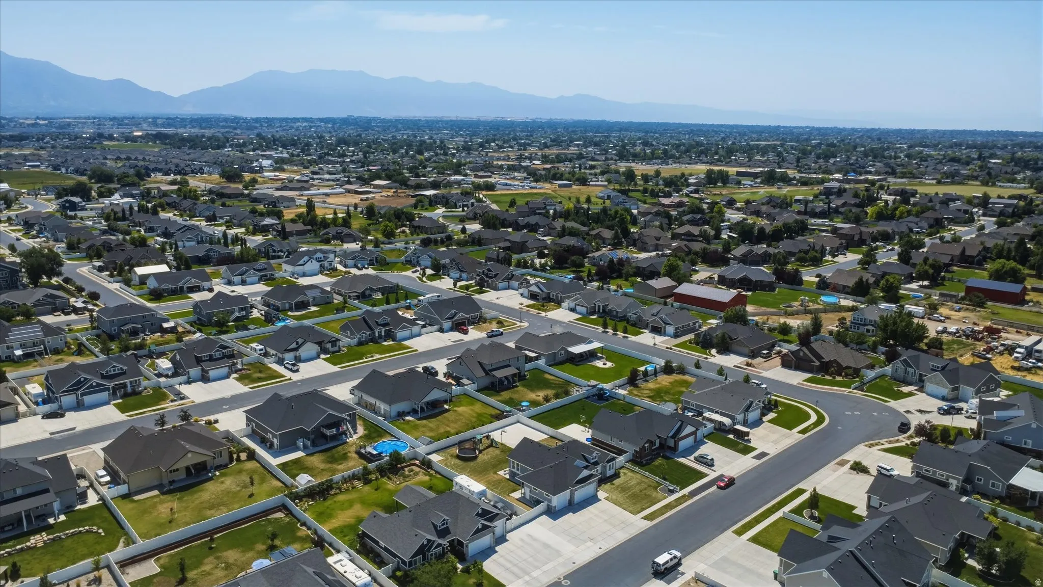 Expansive residential development featuring varied architectural styles and mature landscaping