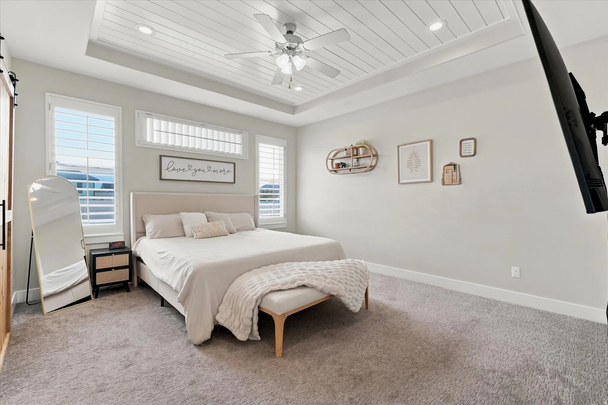 Bedroom featuring a tray ceiling with shiplap detail, recessed lighting, and a ceiling fan