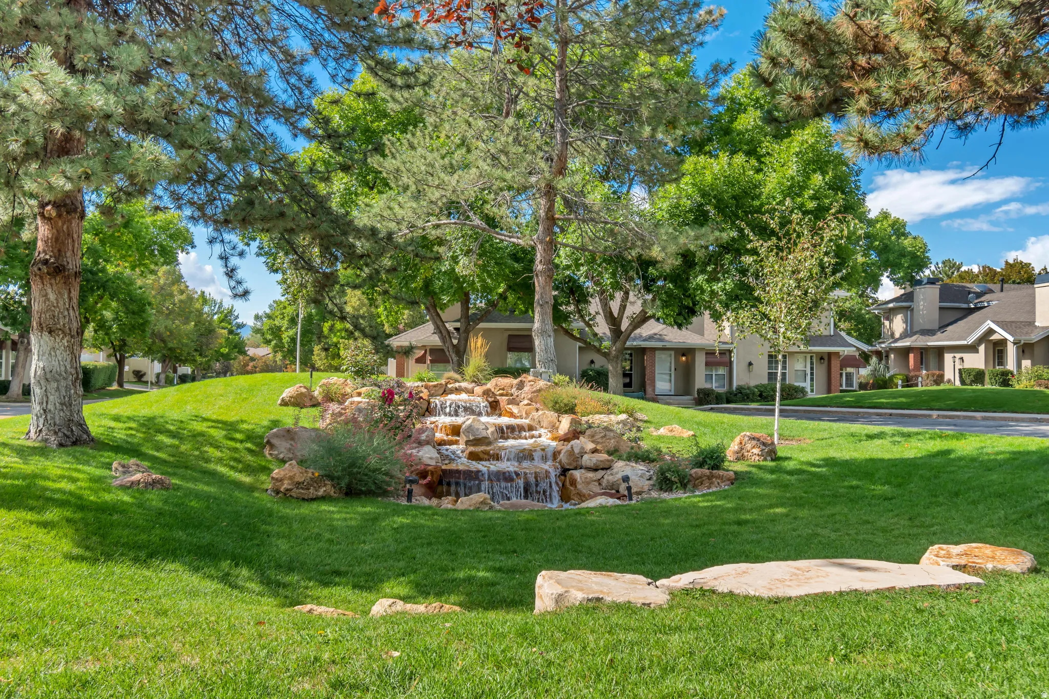 Beautifully landscaped park areas with waterfalls