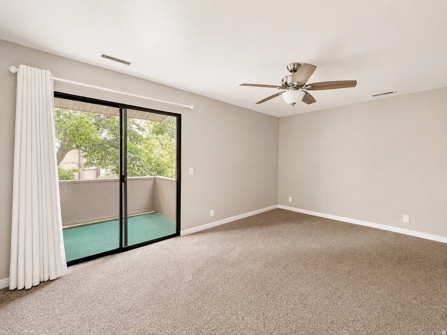 Large primary suite with separate access to covered balcony