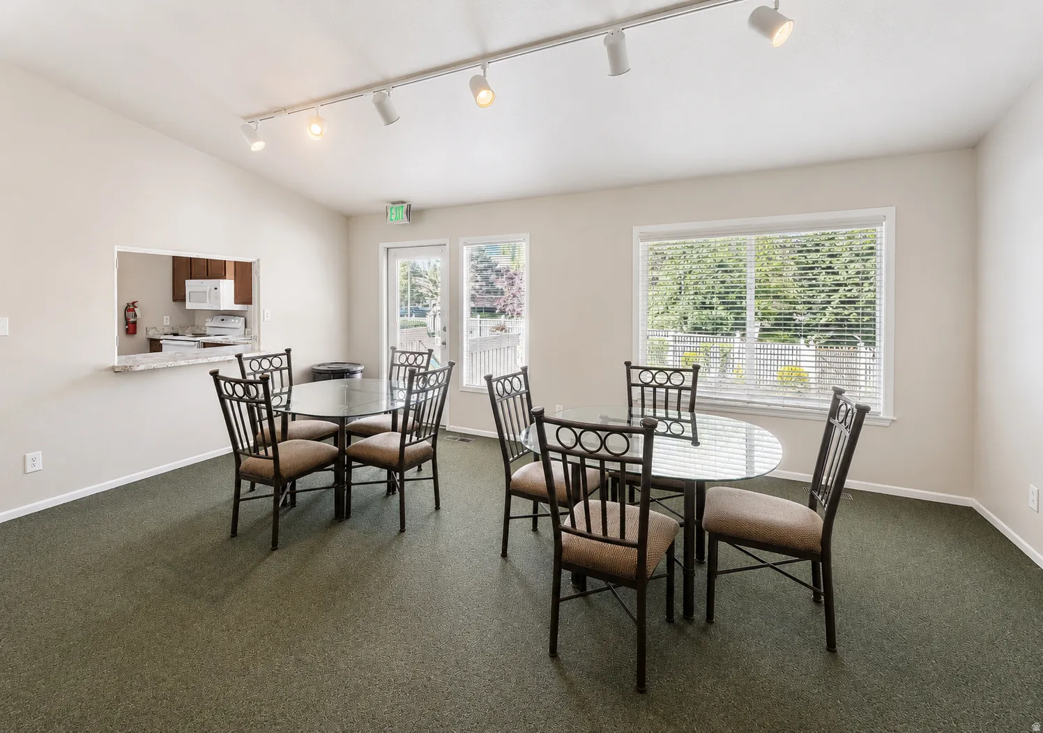 Clubhouse contains eating area and separate kitchen with pass-thru