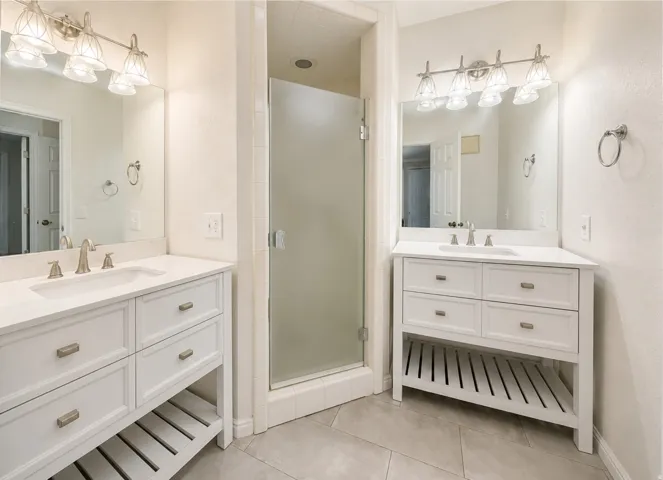 Primary bathroom with dual vanities