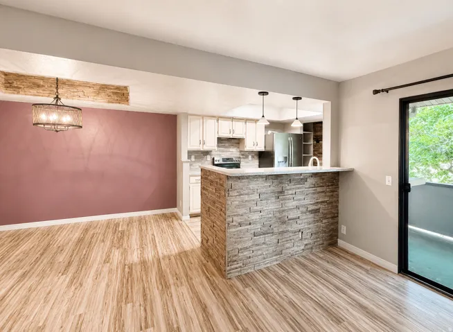 Entertainer kitchen, dining, and living area