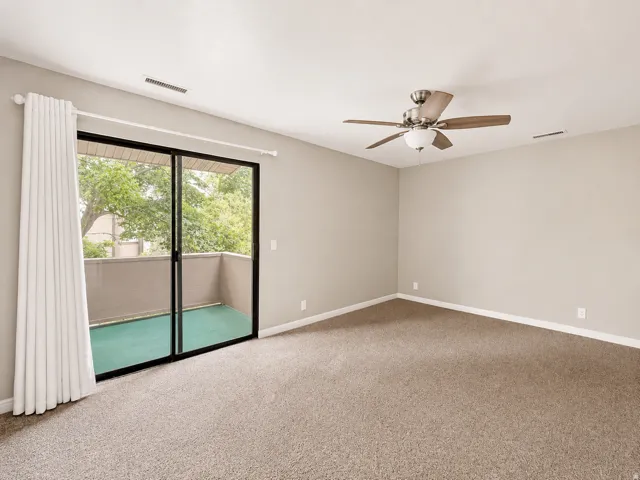 Large primary suite with separate access to covered balcony