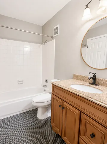 Hall bathroom with large vanity and tub/shower
