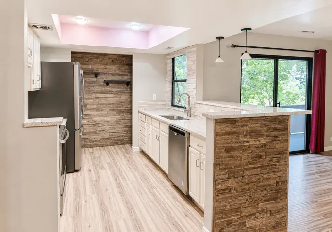 Modern kitchen with granite countertops and stainless appliances
