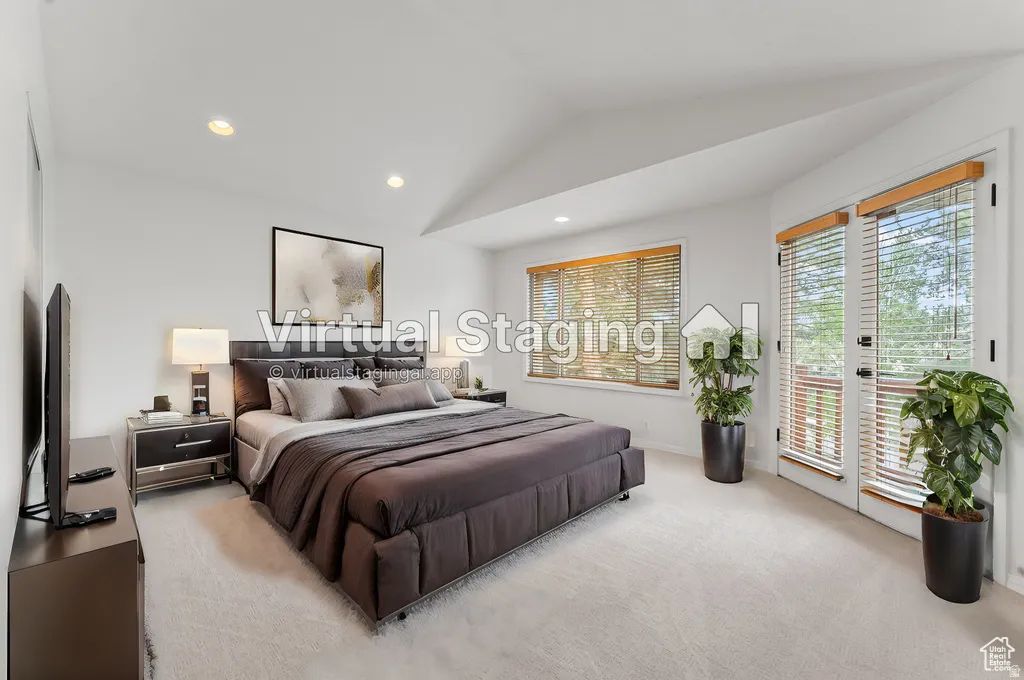 Vaulted ceiling bedroom with recessed lighting, light-colored carpeting, a large window with blinds, and double doors with blinds
