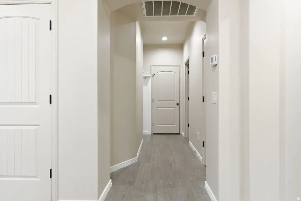Hallway to garage, laundry and half bathroom
