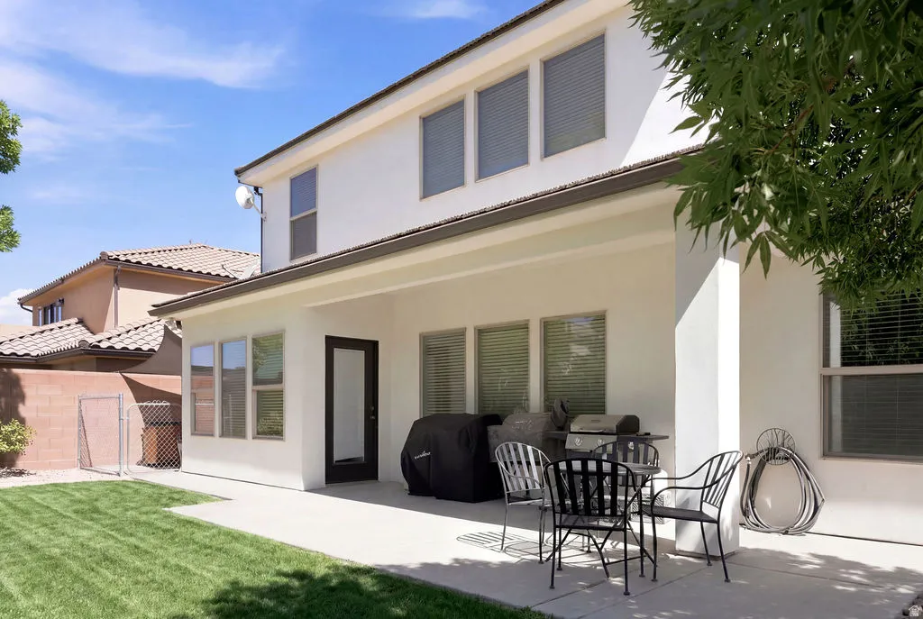 Expansive concrete patio with a covered outdoor area