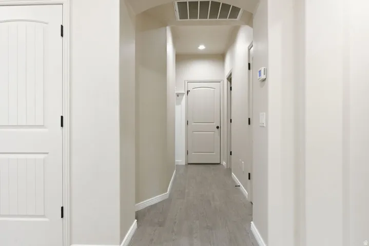 Hallway to garage, laundry and half bathroom