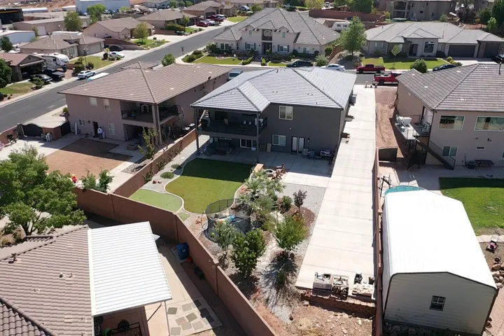 Backyard featuring a putting green, manicured lawn, and defined landscaping