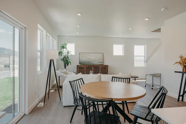 Open-concept living space with wood-finish flooring