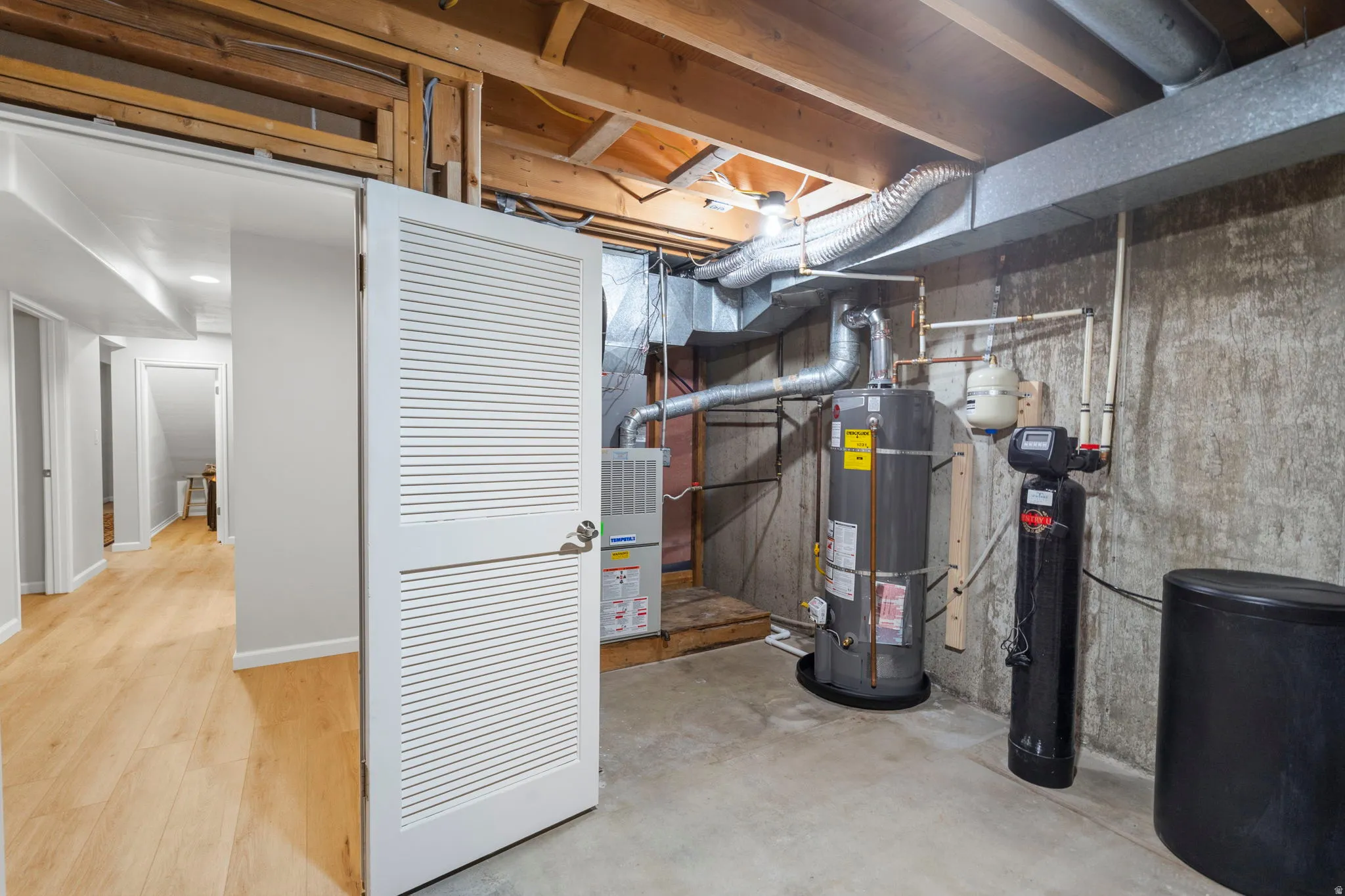 Basement unfinished utility area - furnace, water heater, and water softener system and floor drain