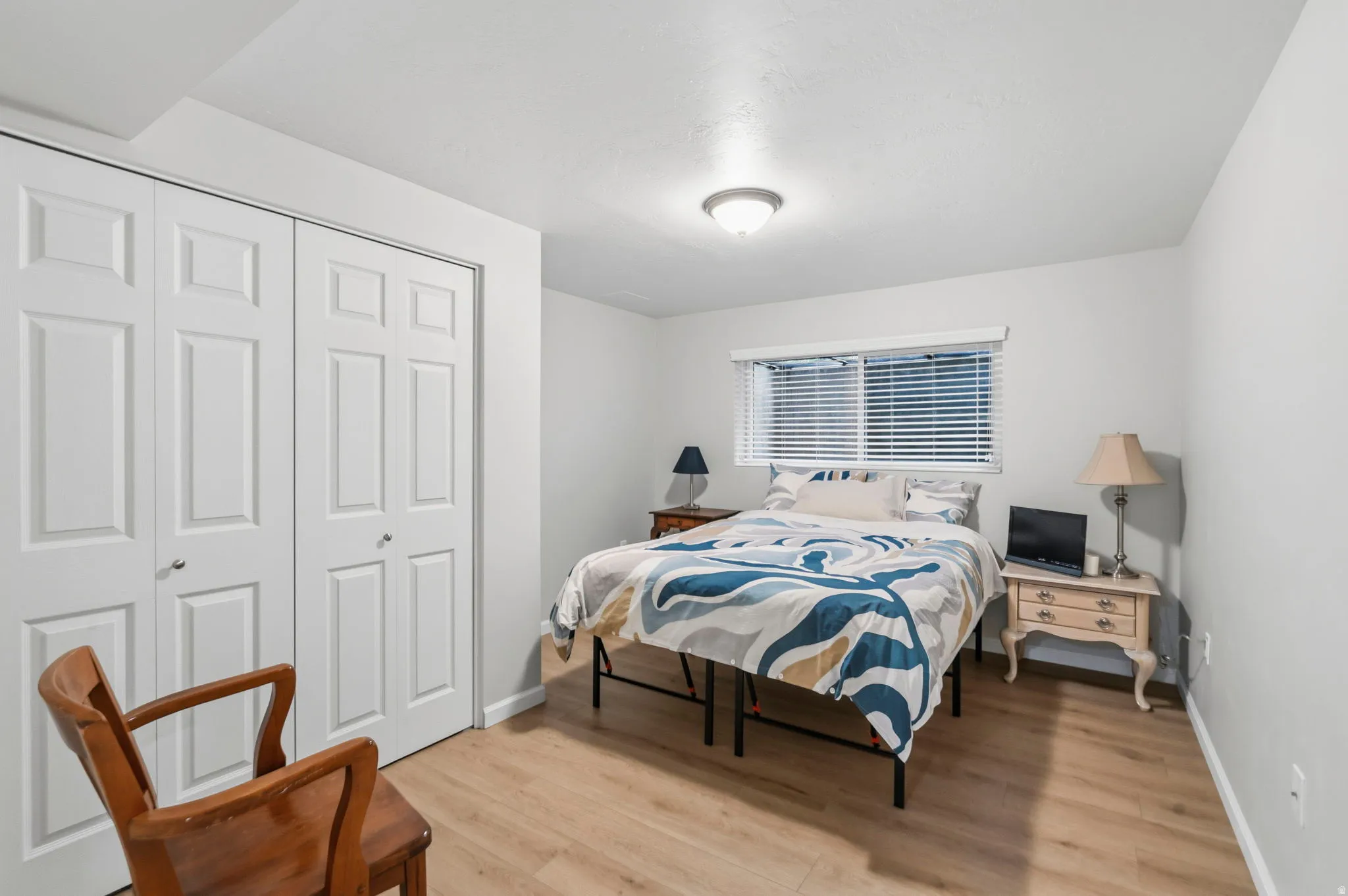 Bedroom/Office featuring LVP flooring, double-door closet, lots of natural light