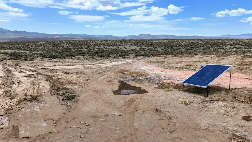 Expansive desert terrain with a mounted solar panel system
