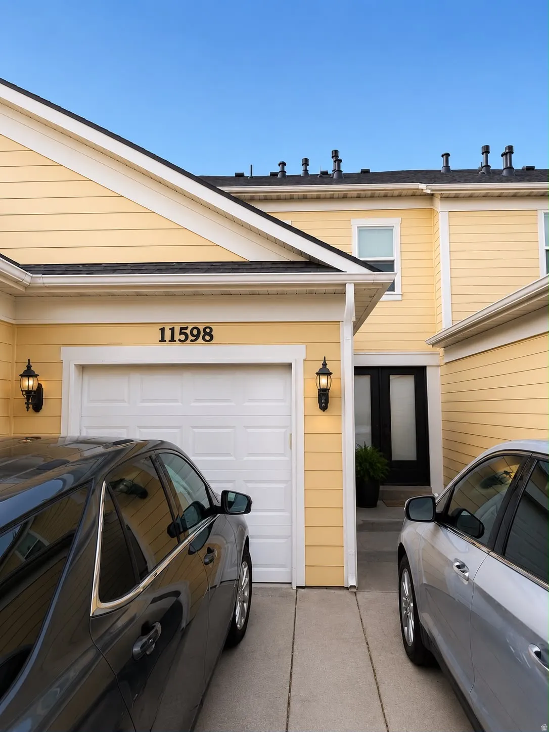 Yellow siding exterior with white trim