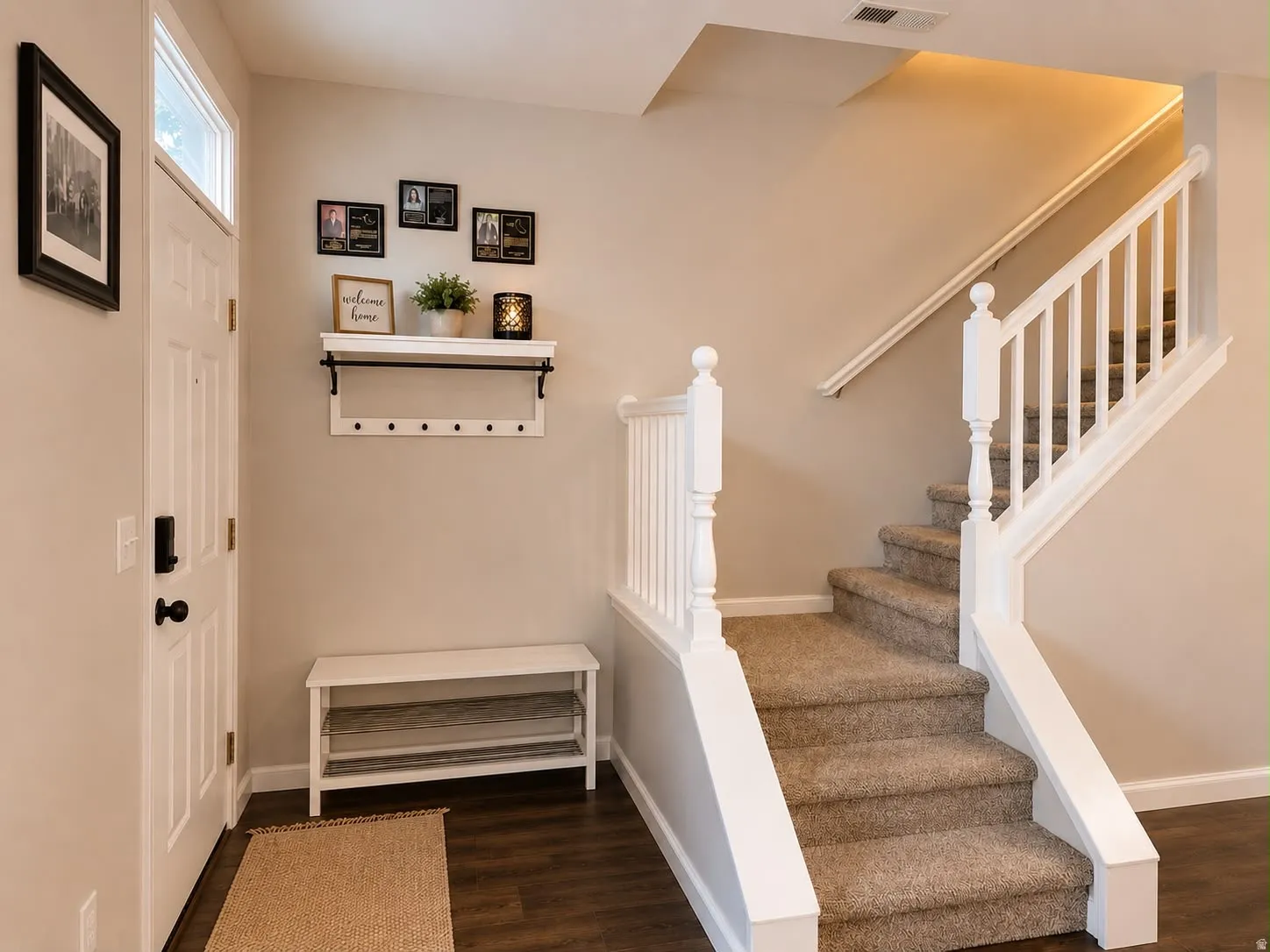 Entryway featuring wood-finish flooring and neutral wall tones