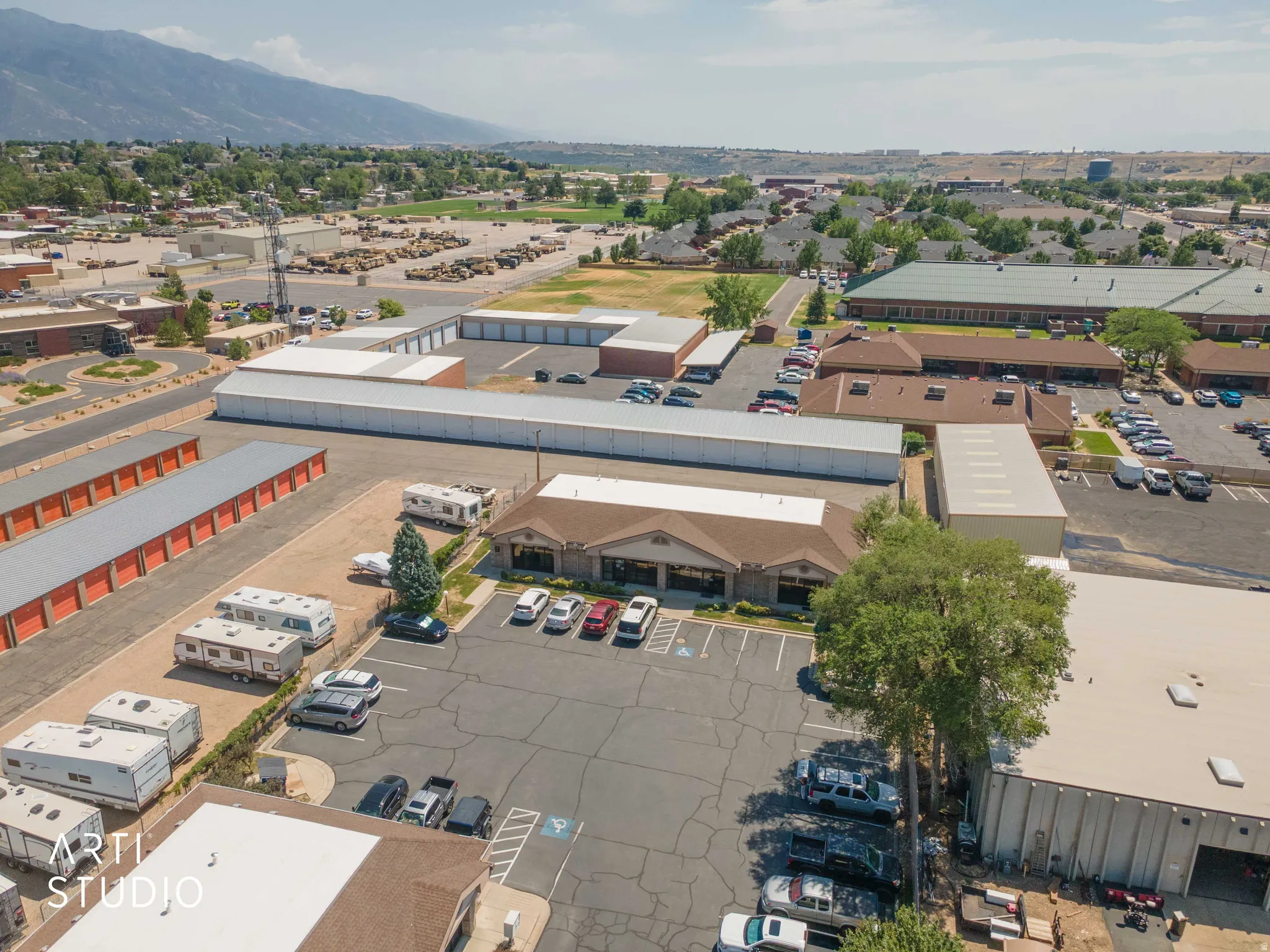 Extensive commercial property featuring multiple structures and ample paved parking areas