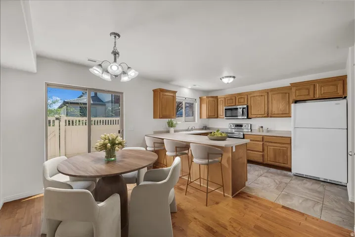Virtually staged to highlight the kitchen's open layout and everyday functionality.