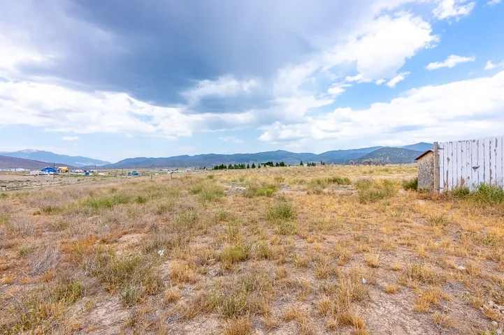 Expansive open land with distant mountain backdrops