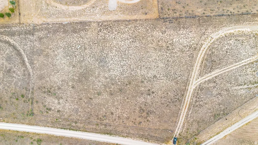 Expansive undeveloped land featuring natural terrain with varied vegetation