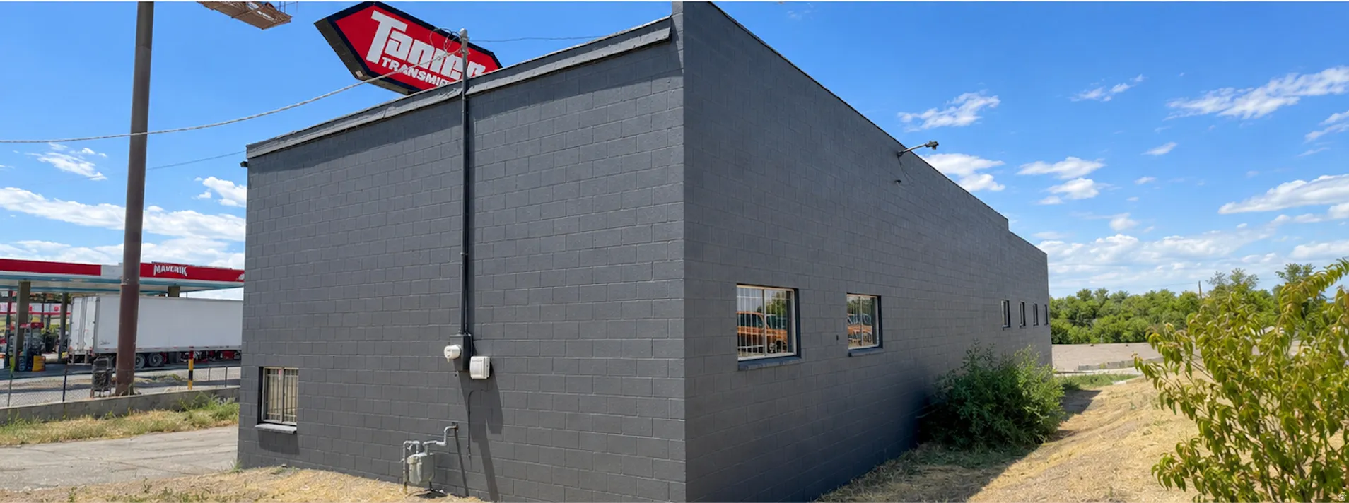 Commercial building featuring block construction and multiple exterior windows