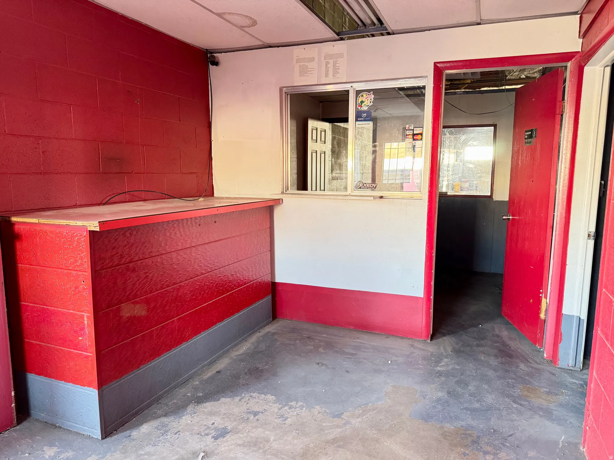 Interior space featuring red block walls and a built-in counter