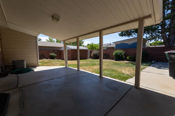Covered patio featuring a concrete slab and support columns