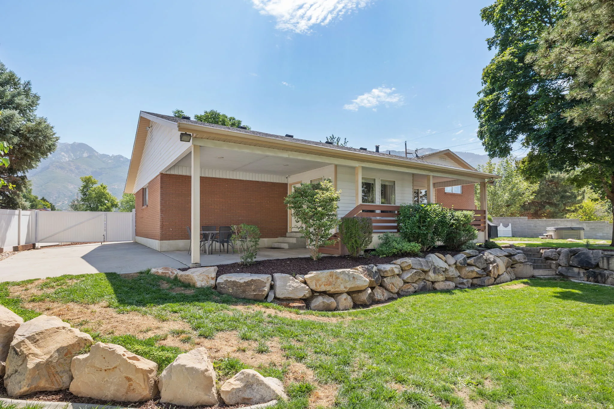 Back of house and covered patio.