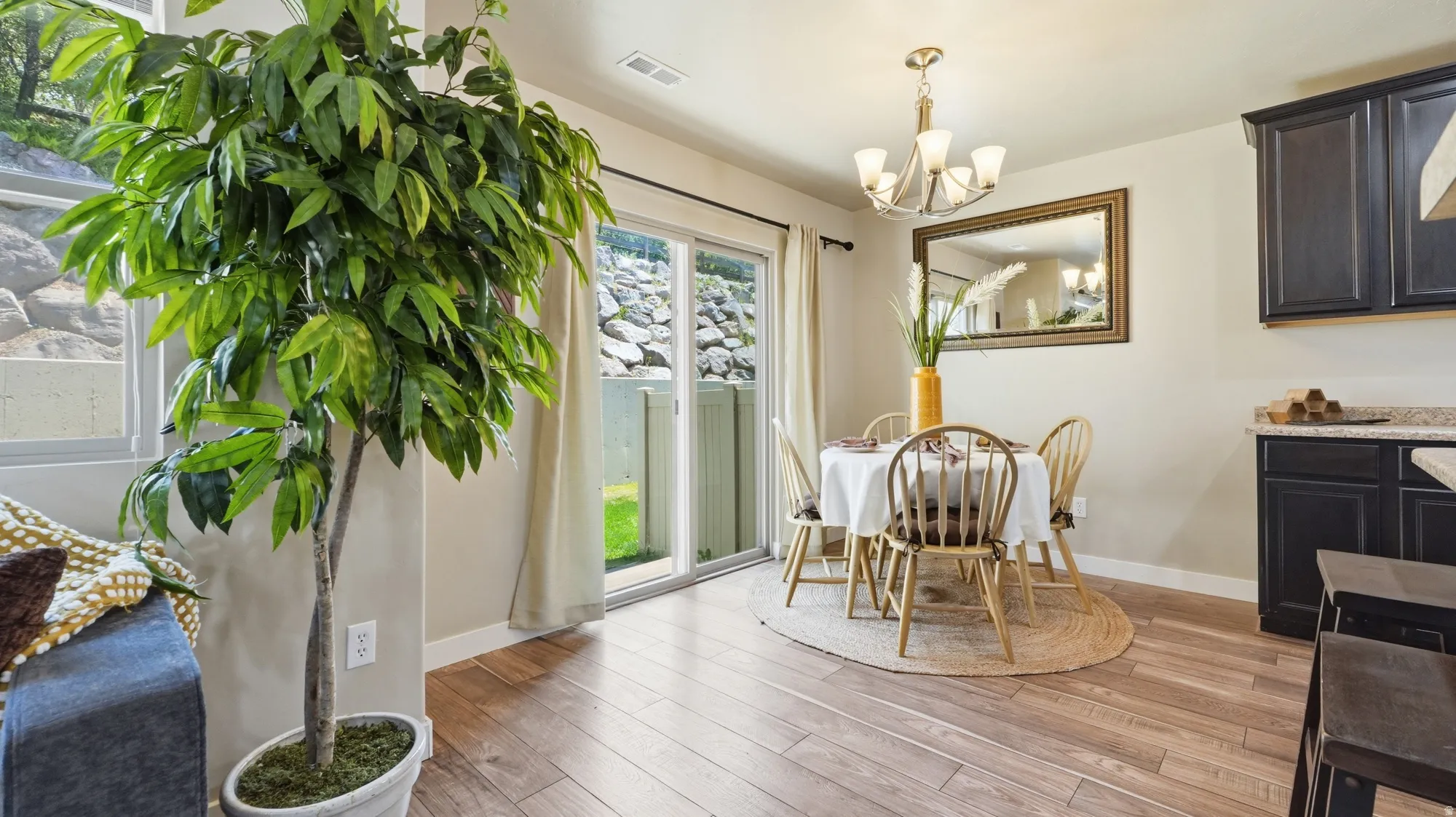 Wood-finish flooring throughout the dining area and kitchen