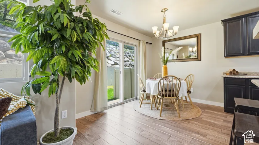 Wood-finish flooring throughout the dining area and kitchen