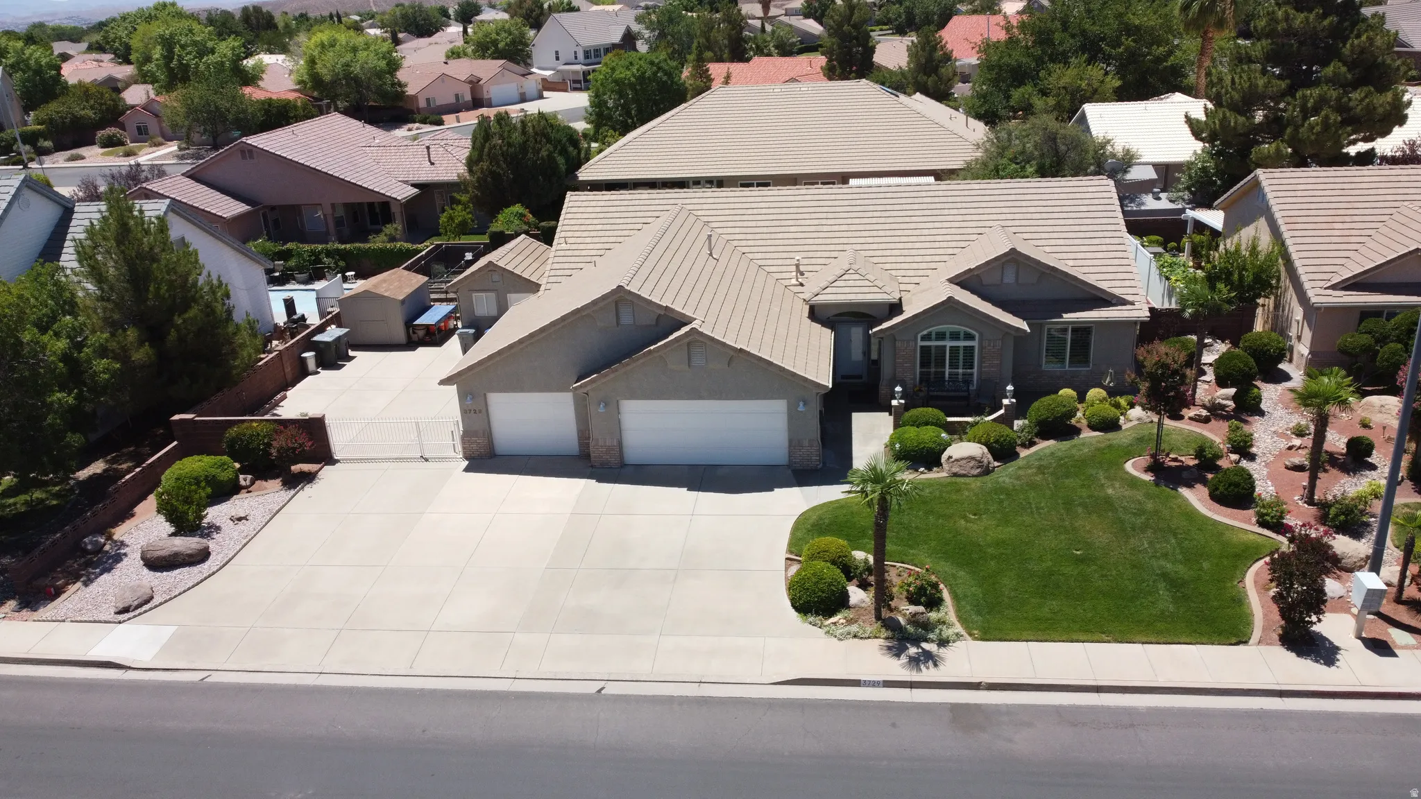 Single-story residence featuring a tile roof and stucco exterior