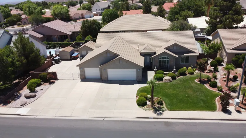 Single-story residence featuring a tile roof and stucco exterior