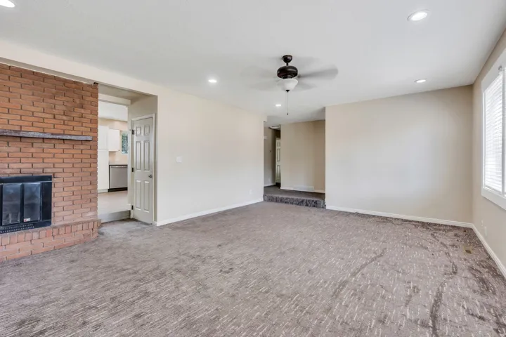 Brick fireplace with a wood mantle