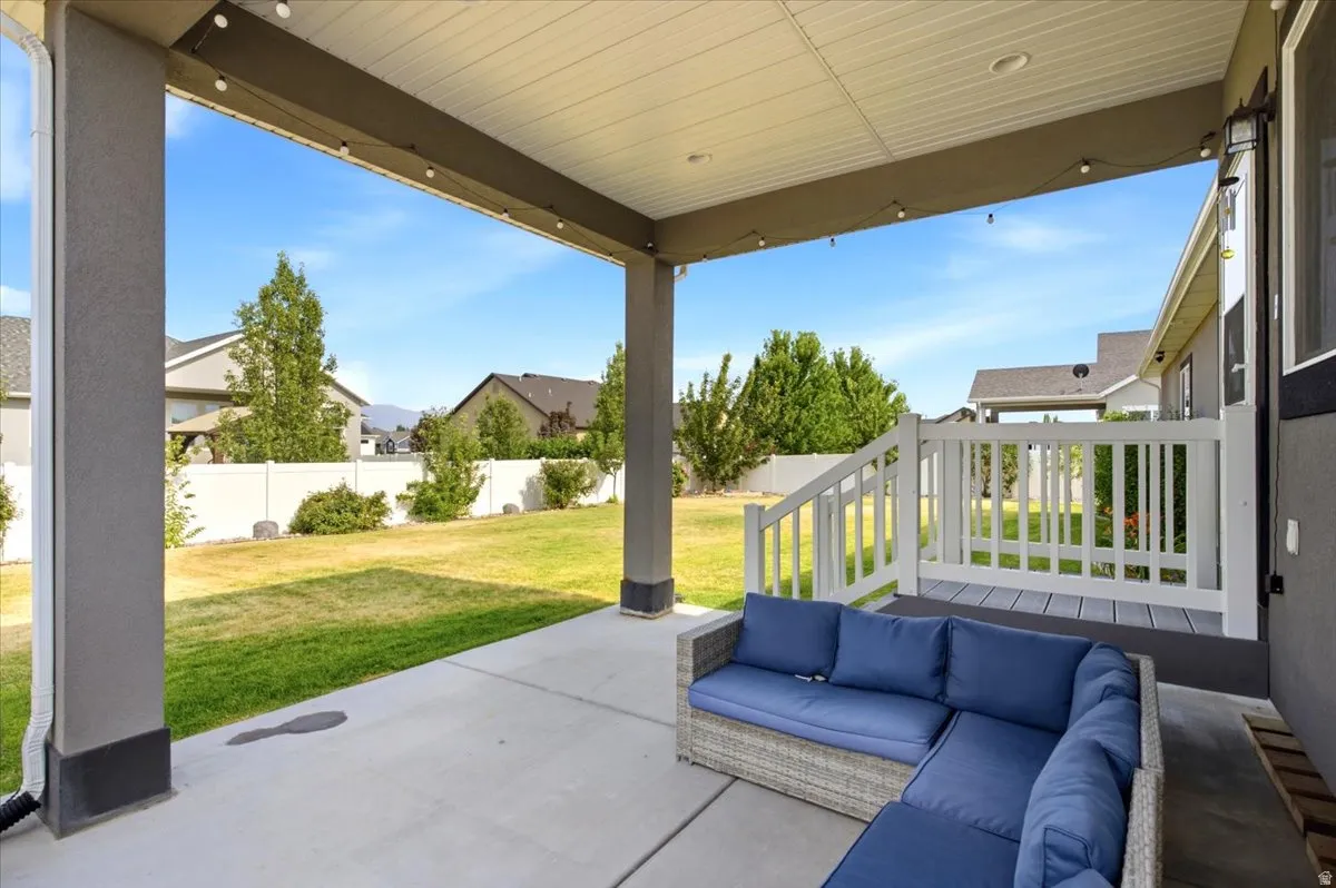 Covered patio with concrete flooring, recessed lighting, and string lights