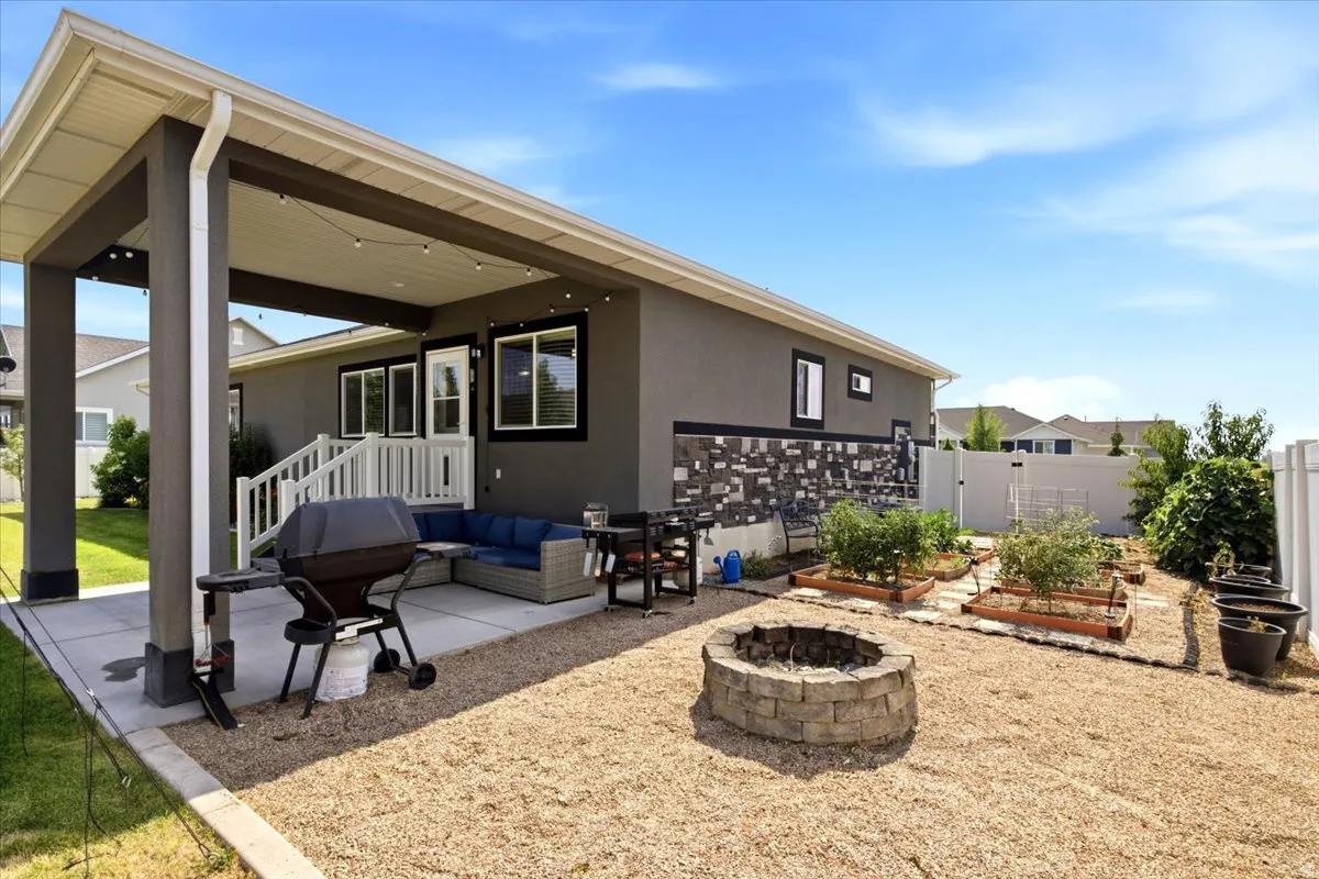 Covered patio featuring a concrete surface and dark support columns