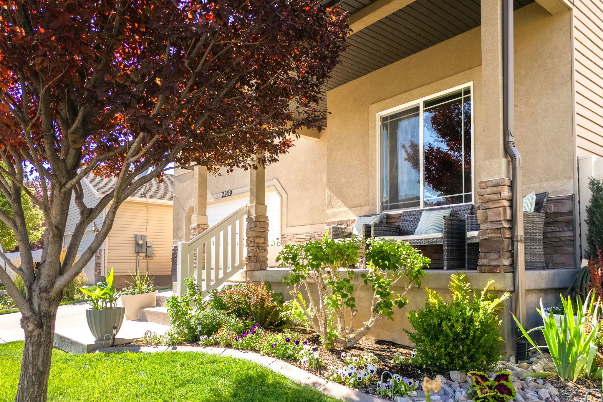 Front exterior with stucco and siding finishes