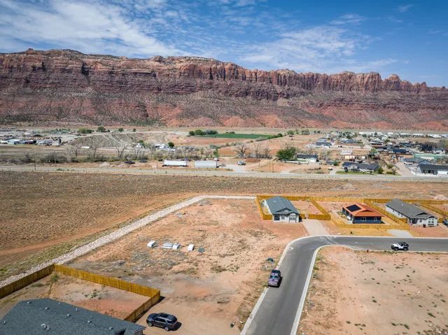Newly constructed residential development featuring a paved cul-de-sac and individual property fencing