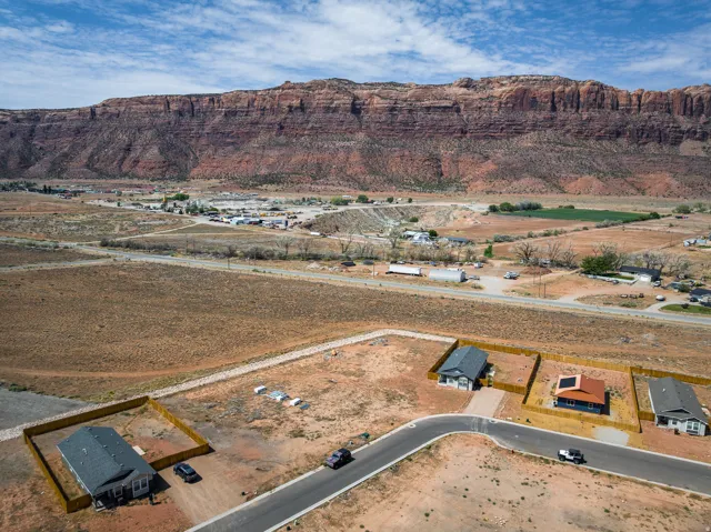 New construction homes featuring fenced yards and asphalt driveways